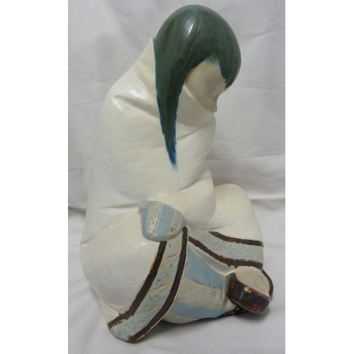 59 - A Large size Lladro porcelain figure of a seated Inuit girl pulling a blanket around her, printed ma... 