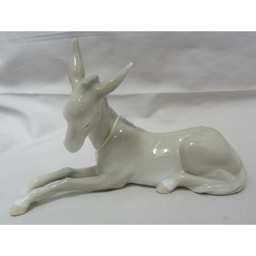 66 - A Lladro porcelain figure of Little Horse Resting, 1203; a Lladro figure of a Nativity donkey, 5483;... 