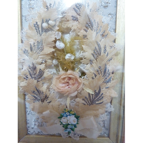 73 - A shadow box framed Victorian love token - forget me not, of silk flowers and leaves with lace bow a... 