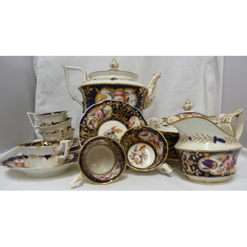 74 - An English porcelain tea and coffee service, in Coalport style, painted with mirror form cartouches ... 