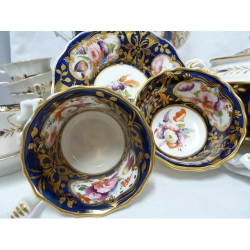 74 - An English porcelain tea and coffee service, in Coalport style, painted with mirror form cartouches ... 