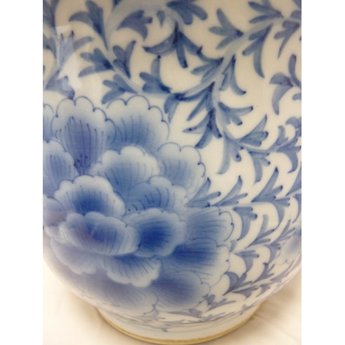 80 - A Chinese blue and white porcelain jardiniere and stand, decorated with peony motifs (2)