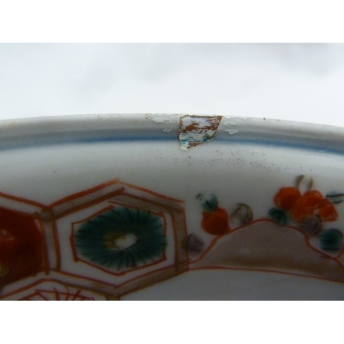 81 - A Japanese Arita Porcelain bowl, decorated in Imari palette with cranes, cell diapers and a central ... 