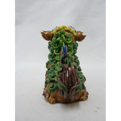 84 - A Chinese pottery Dog of Fo figure, intricately modelled with scrolled fur, bright polychrome decora... 