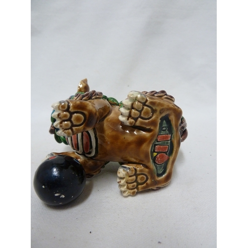 84 - A Chinese pottery Dog of Fo figure, intricately modelled with scrolled fur, bright polychrome decora... 