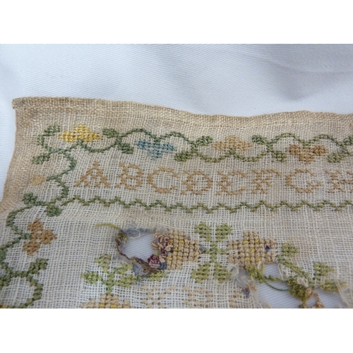 115 - A part late 18th century sampler, dated 1794, worked with designs of birds, pot plants trees and pea... 