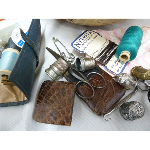 132 - Sewing requisites - including thimbles and scissors, needle cases, buttons and many threads within a... 