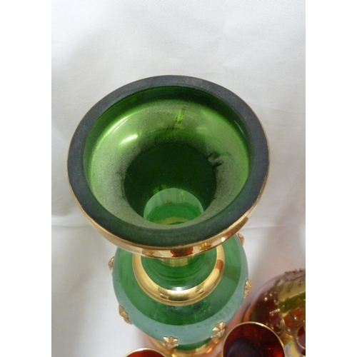 146 - A Bohemian glass decanter and stopper, for the Venetian market, ruby red with impasto enamelled flow... 