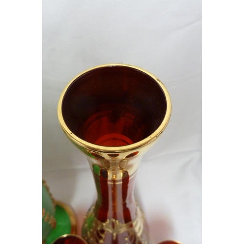 146 - A Bohemian glass decanter and stopper, for the Venetian market, ruby red with impasto enamelled flow... 