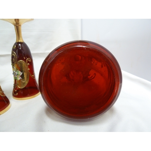 146 - A Bohemian glass decanter and stopper, for the Venetian market, ruby red with impasto enamelled flow... 