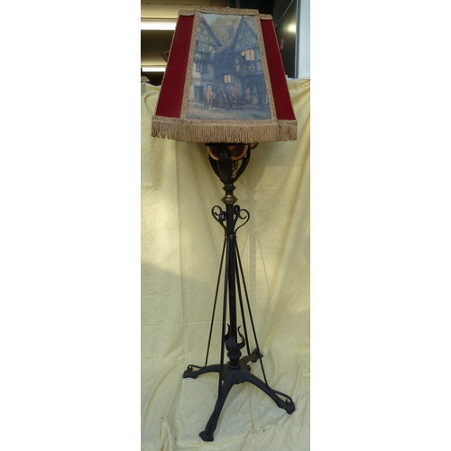 126 - An Arts and Crafts wrought iron and copper telescopic standard oil lamp, in the style of W A S Benso... 