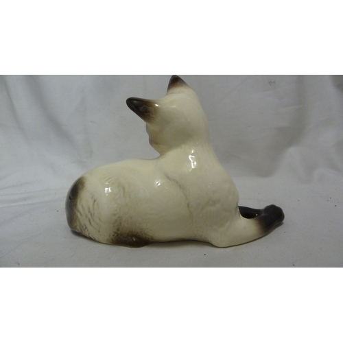 54 - A Beswick pottery figure of a Siamese cat, numbered 1558, 18.5cm max.