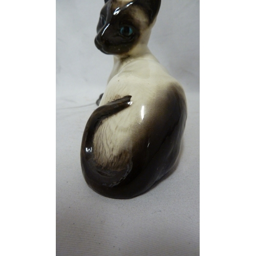 54 - A Beswick pottery figure of a Siamese cat, numbered 1558, 18.5cm max.