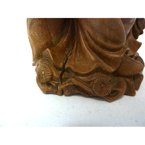 46 - A Bamboo root carving of a female figure with a dog, 22cm high approx.