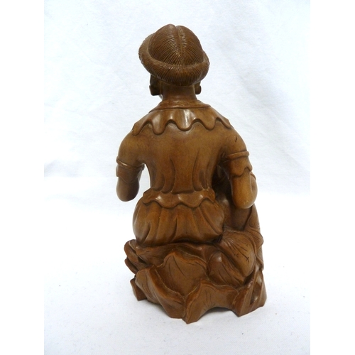 46 - A Bamboo root carving of a female figure with a dog, 22cm high approx.