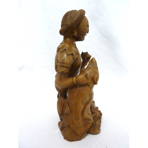 46 - A Bamboo root carving of a female figure with a dog, 22cm high approx.