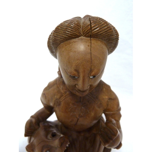 46 - A Bamboo root carving of a female figure with a dog, 22cm high approx.