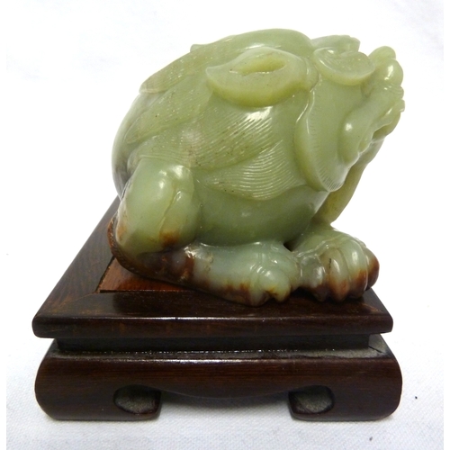 42 - A large Chinese Celedon jade figure of a Kylin, 12.5cm max; and a wooden stand (2)