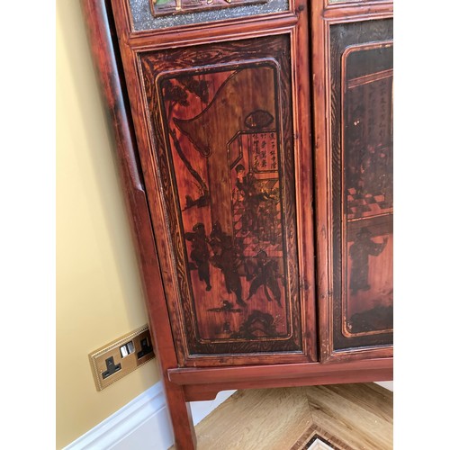 39 - A Chinese carved wood corner cabinet, 1 m 71 cm h x 65 cm w x 38.5cm deep approx. 
**This item is he... 