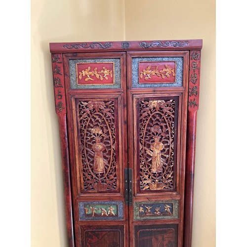 39 - A Chinese carved wood corner cabinet, 1 m 71 cm h x 65 cm w x 38.5cm deep approx. 
**This item is he... 