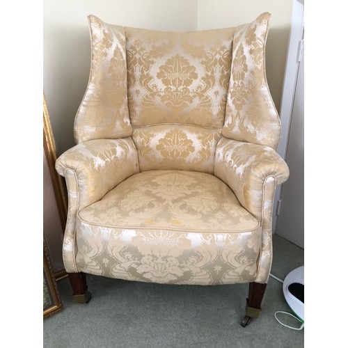 129 - WITHDRAWN - A Wing Back Chair upholstered in pale yellow silk. ** see image 2 for true colour. This ... 