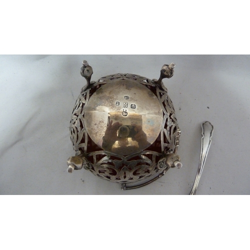 1 - A Victorian silver sugar basket, circular, the whole pierced with foliate scrolls with vacant shield... 