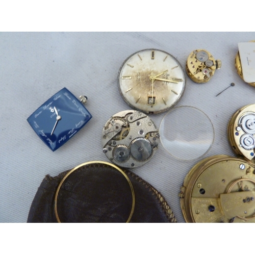 14 - Restorers Box - a quantity of pocket watch and wrist watch parts, movements, including a dark blue e... 