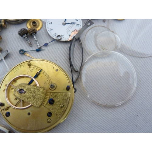 14 - Restorers Box - a quantity of pocket watch and wrist watch parts, movements, including a dark blue e... 