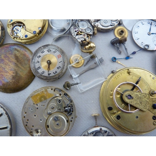 14 - Restorers Box - a quantity of pocket watch and wrist watch parts, movements, including a dark blue e... 