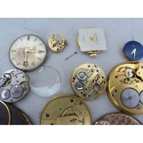 14 - Restorers Box - a quantity of pocket watch and wrist watch parts, movements, including a dark blue e... 