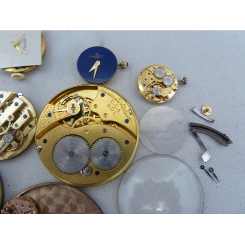 14 - Restorers Box - a quantity of pocket watch and wrist watch parts, movements, including a dark blue e... 