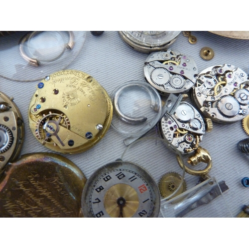 14 - Restorers Box - a quantity of pocket watch and wrist watch parts, movements, including a dark blue e... 