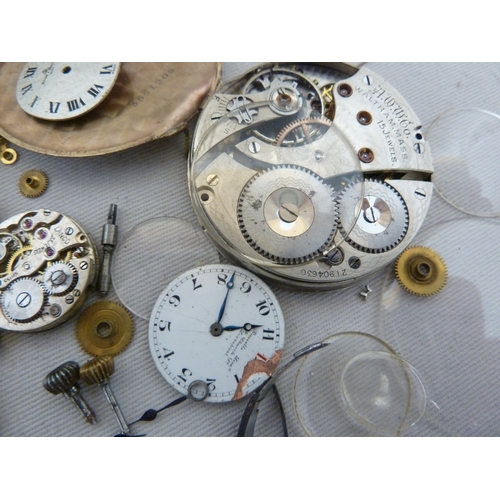 14 - Restorers Box - a quantity of pocket watch and wrist watch parts, movements, including a dark blue e... 