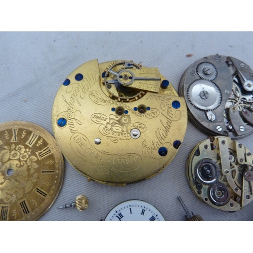 16 - Restorers Box - a quantity of Pocket watch spare parts and movements, including dials marked for Tho... 