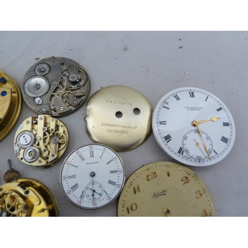 16 - Restorers Box - a quantity of Pocket watch spare parts and movements, including dials marked for Tho... 