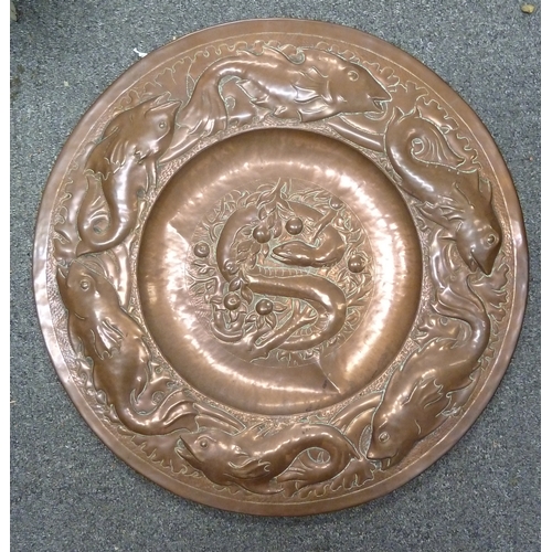 180 - An Arts and Crafts beaten copper Charger, probably Newton School Cambridgeshire, decorated with a ce... 