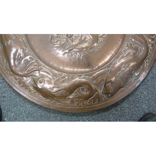 180 - An Arts and Crafts beaten copper Charger, probably Newton School Cambridgeshire, decorated with a ce... 