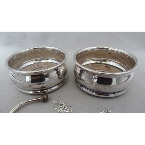 2 - A pair of silver plated condiment coasters, unmarked; a white metal key ring with heart shaped fob, ... 