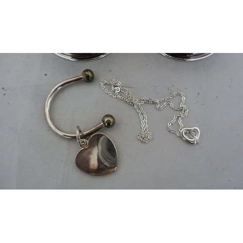 2 - A pair of silver plated condiment coasters, unmarked; a white metal key ring with heart shaped fob, ... 