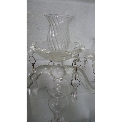 50 - A pair of glass three light candle stick lustres, colourless, 28 cm high (2)