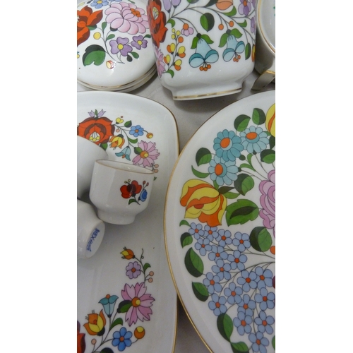 67 - Mid Century Design - A group of Hungarian Ceramics, all decorated in bright colours with stylised fl... 