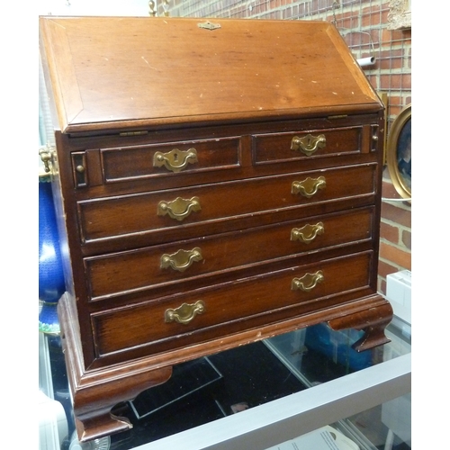 69 - A miniature fall front bureau, of two short drawers over three long, brass fittings and carry handle... 