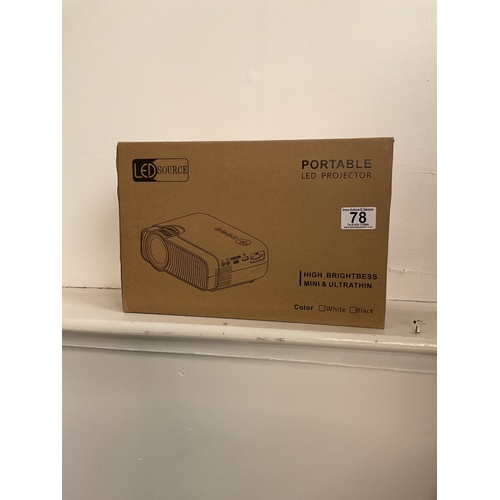 78 - New, boxed, LED portable projector