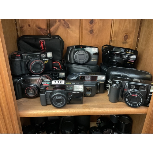 110 - Shelf of point and shoot cameras