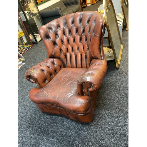 117 - Brown leather button back Chesterfield armchair