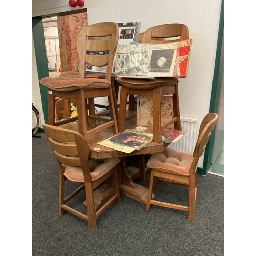 99 - Hexagonal retro solid oak dining table, with 8 oak chairs