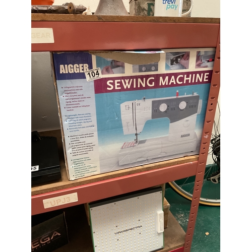 104 - Boxed electric sewing machine