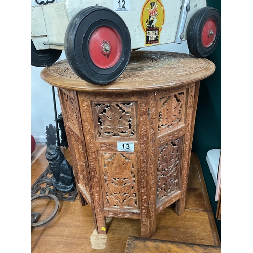 13 - Carved Indonesian wood folding base side table