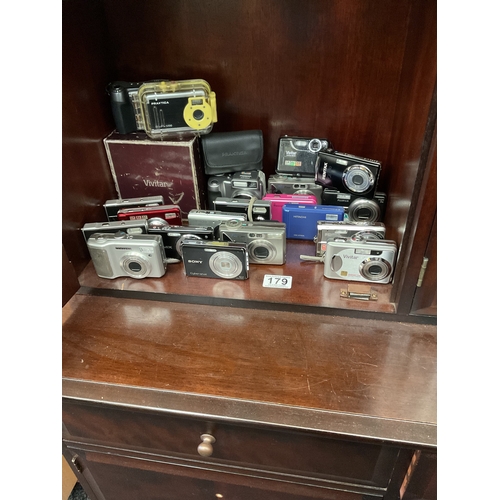 179 - Shelf of digital compact cameras