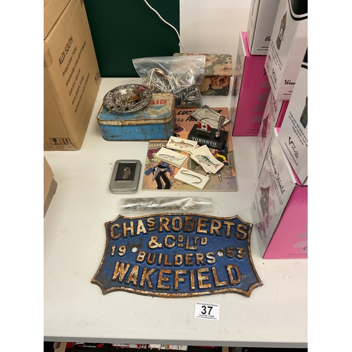 37 - Chas Roberts and co. Wakefield cast sign, vintage tins, coins, and others